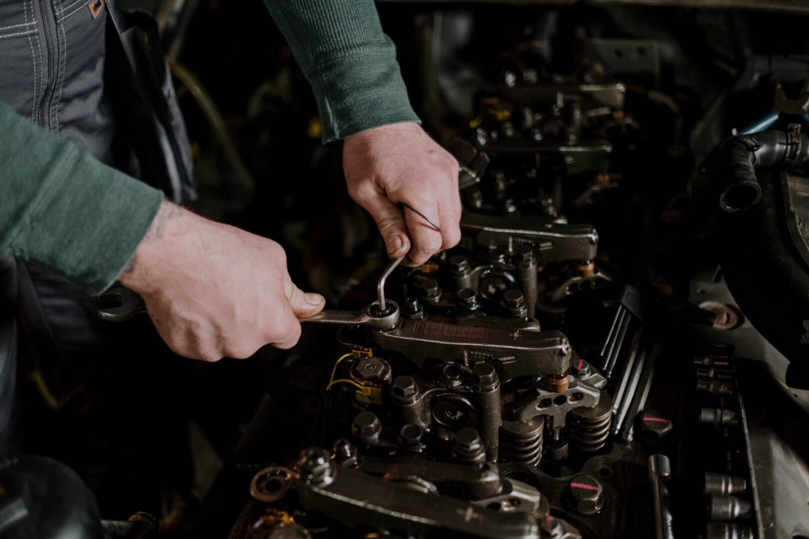 A person is working on an engine.